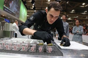 Elias Laderack assembling his dessert on the WCM competition