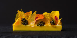 Gold beet panna cotta, bergamot, Osetra caviar, fermented cashew cream, mandarin, nasturtium by Roberto Cortez